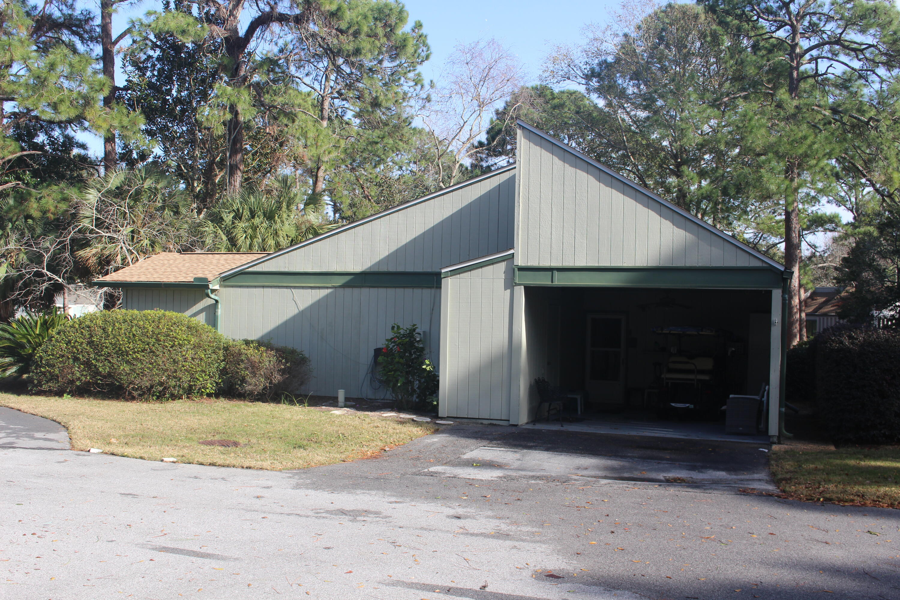 517 Augusta Way, Unit 11001 Miramar Beach, FL 32550 - Photo 21 of 27 a view of a house with a yard and garage