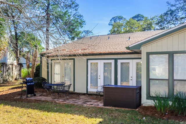 a view of house with yard outdoor seating area