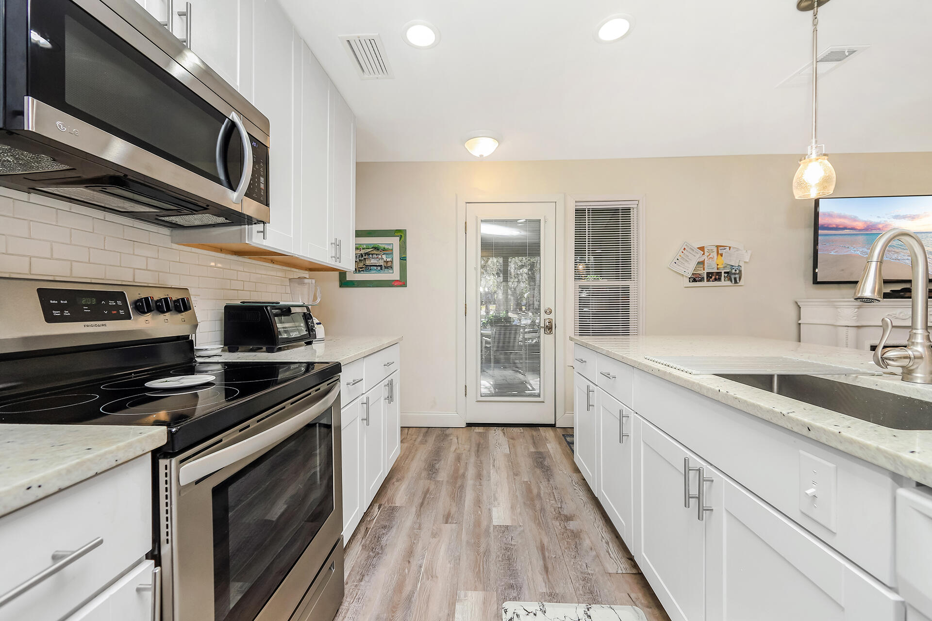 517 Augusta Way, Unit 11001 Miramar Beach, FL 32550 - Photo 4 of 27 a kitchen with stainless steel appliances granite countertop a stove and a sink