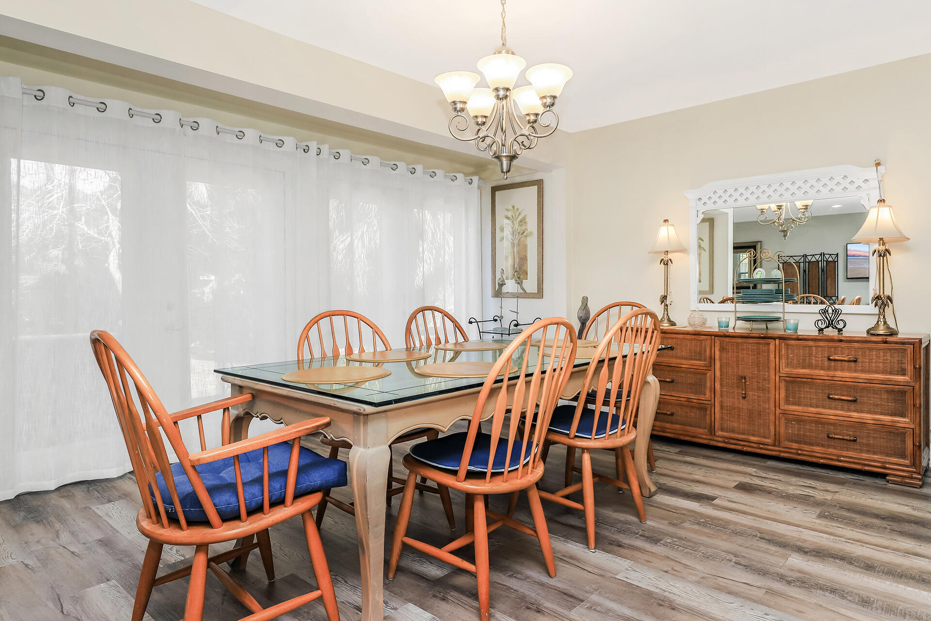 517 Augusta Way, Unit 11001 Miramar Beach, FL 32550 - Photo 7 of 27 a view of a dining room with furniture wooden floor and chandelier