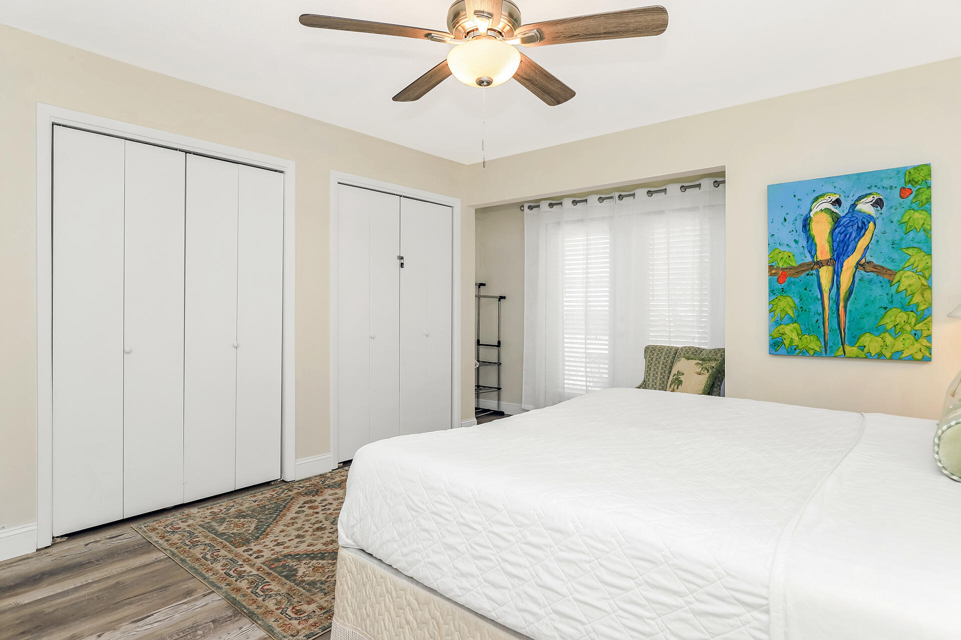 517 Augusta Way, Unit 11001 Miramar Beach, FL 32550 - Photo 9 of 27 a bedroom with a bed and a chandelier
