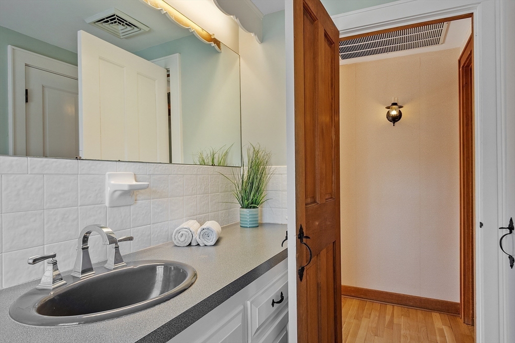 54 Ayer Road Harvard, MA 01451 - Photo 16 of 27 a bathroom with a sink and a mirror