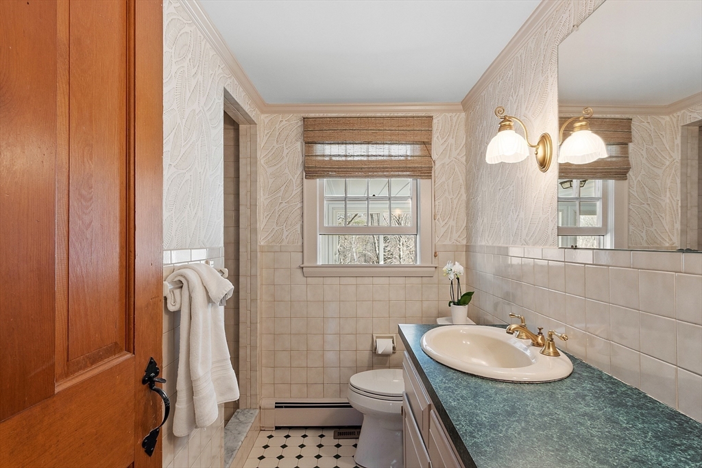 54 Ayer Road Harvard, MA 01451 - Photo 9 of 27 a bathroom with a sink a toilet and shower