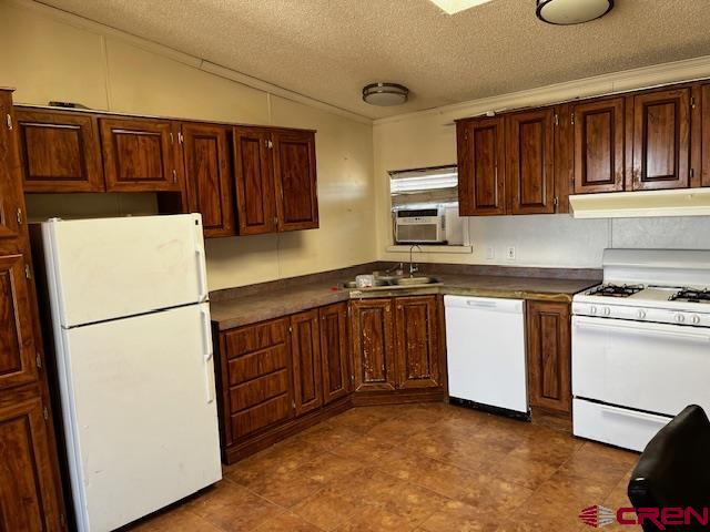 61401 County Road B Center, CO 81125 - Photo 8 of 8 a kitchen with a refrigerator and a stove top oven