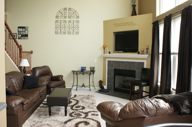 2378 Georgetown Circle Aurora, IL 60503 - Photo 4 of 13 a living room with furniture fireplace and flat screen tv