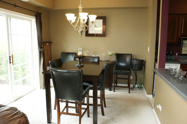 2378 Georgetown Circle Aurora, IL 60503 - Photo 5 of 13 a view of a dining room with furniture and chandelier