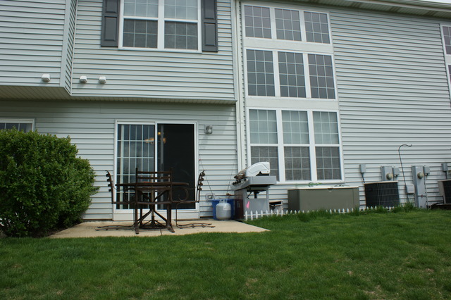 2378 Georgetown Circle Aurora, IL 60503 - Photo 10 of 13 a house view with a garden space