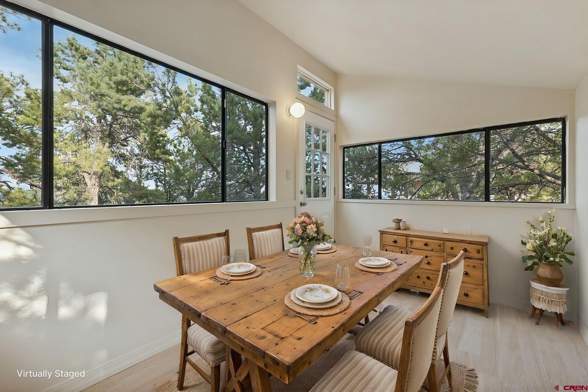 481 Far View Road Durango, CO 81303 - Photo 11 of 45 a view of a dining room with furniture window and wooden floor