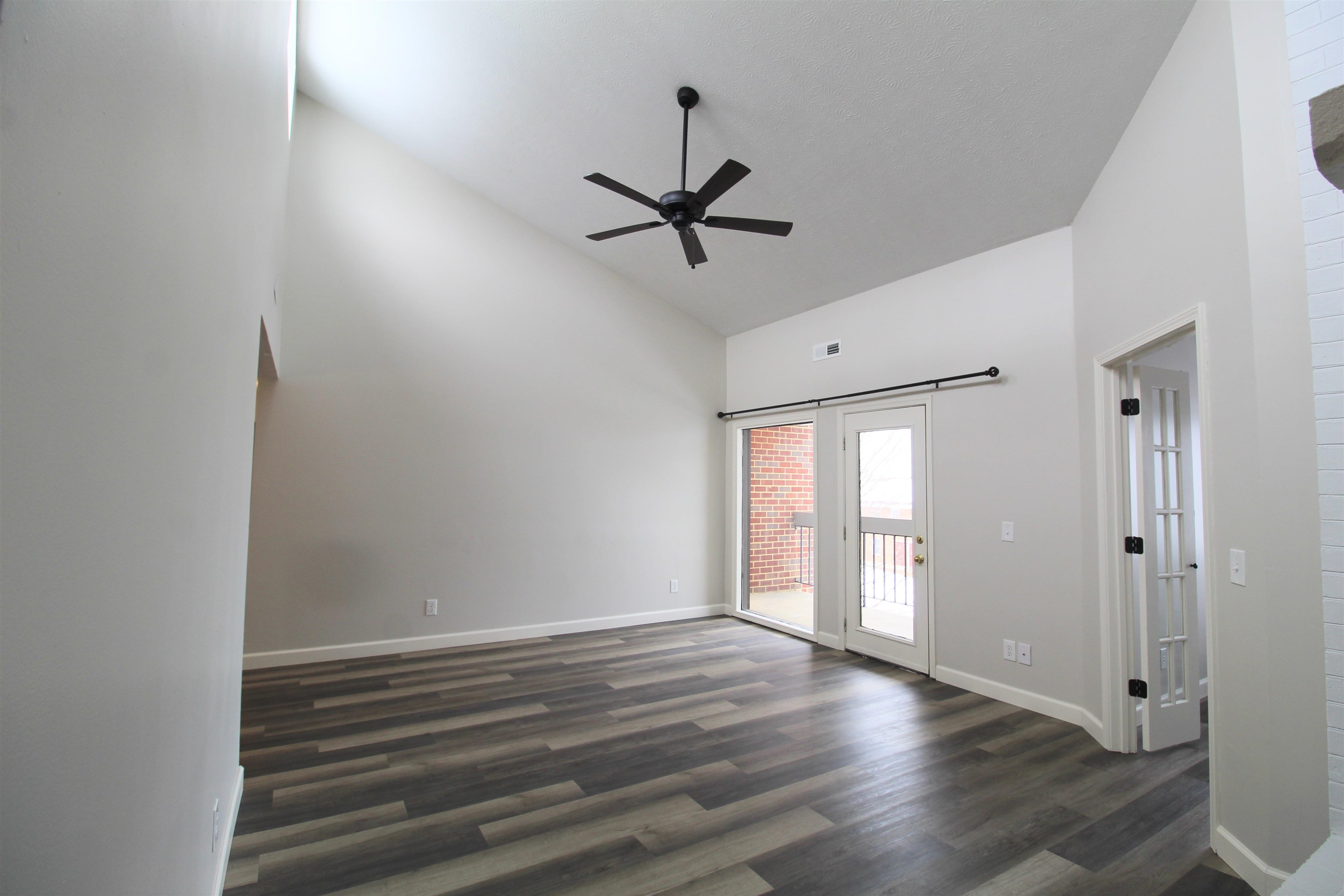 1116 Blue Ridge Drive, Unit 10 Harrisonburg, VA 22802 - Photo 11 of 20 wooden floor in an empty room with a window