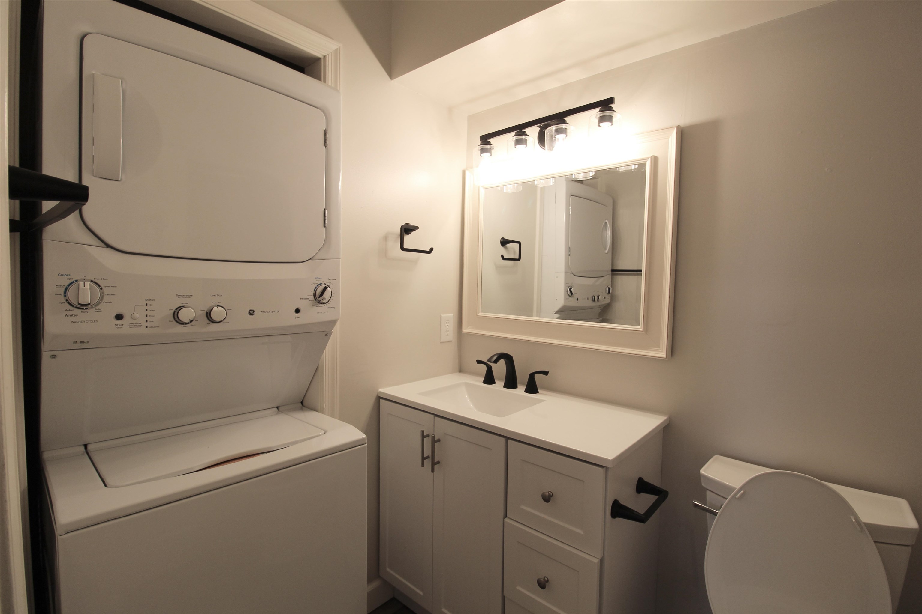 1116 Blue Ridge Drive, Unit 10 Harrisonburg, VA 22802 - Photo 14 of 20 a bathroom with a sink mirror vanity and toilet