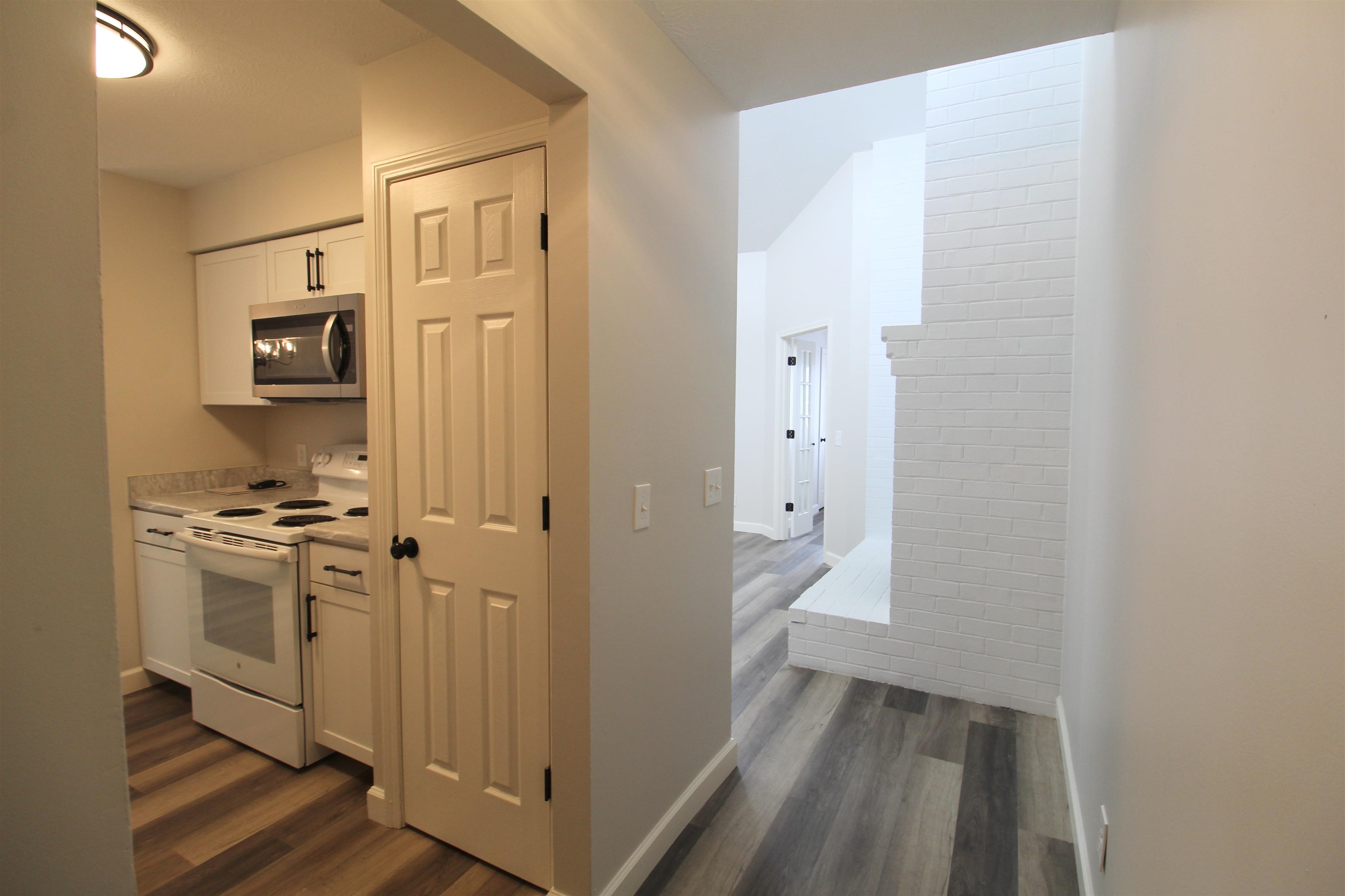 1116 Blue Ridge Drive, Unit 10 Harrisonburg, VA 22802 - Photo 9 of 20 a view of a hallway with wooden floor and a bathroom