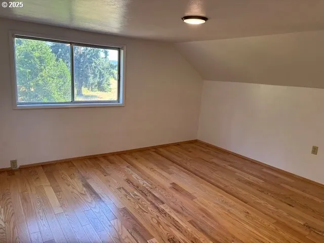 a room with window and a bathroom