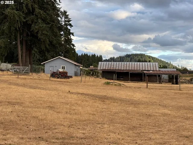 a view of a house with backyard porch and sitting area