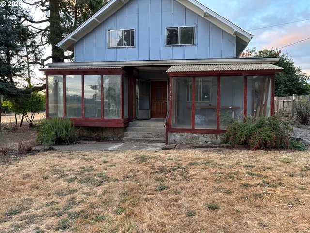 a backyard of apartments with large trees