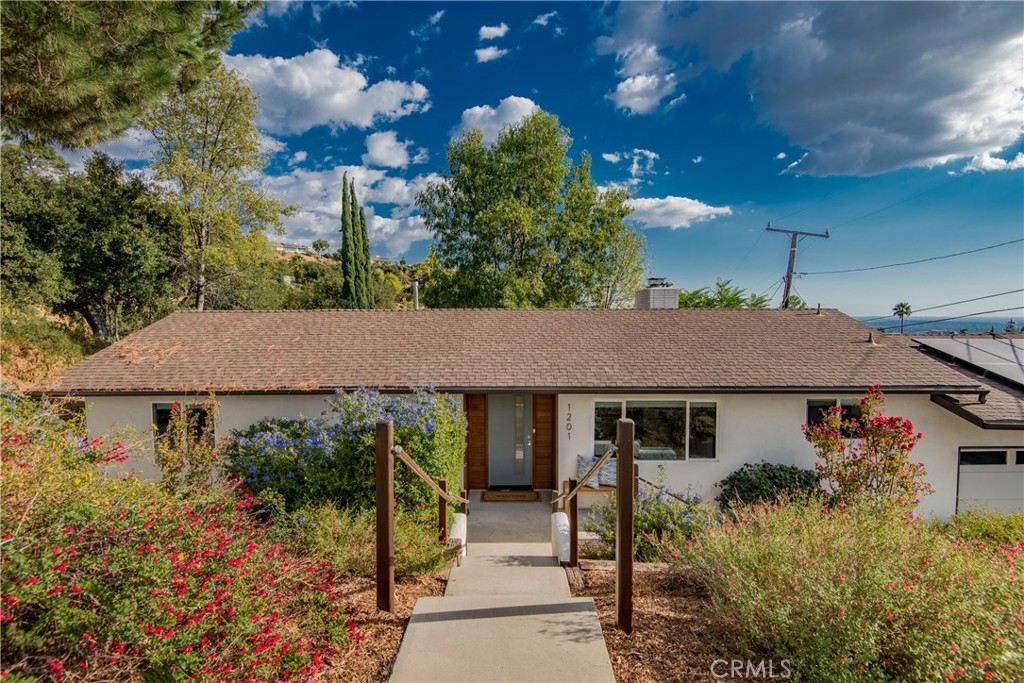1201 Sunny Oaks Circle Altadena, CA 91001 - Photo 1 of 3 a aerial view of a house with a yard and potted plants