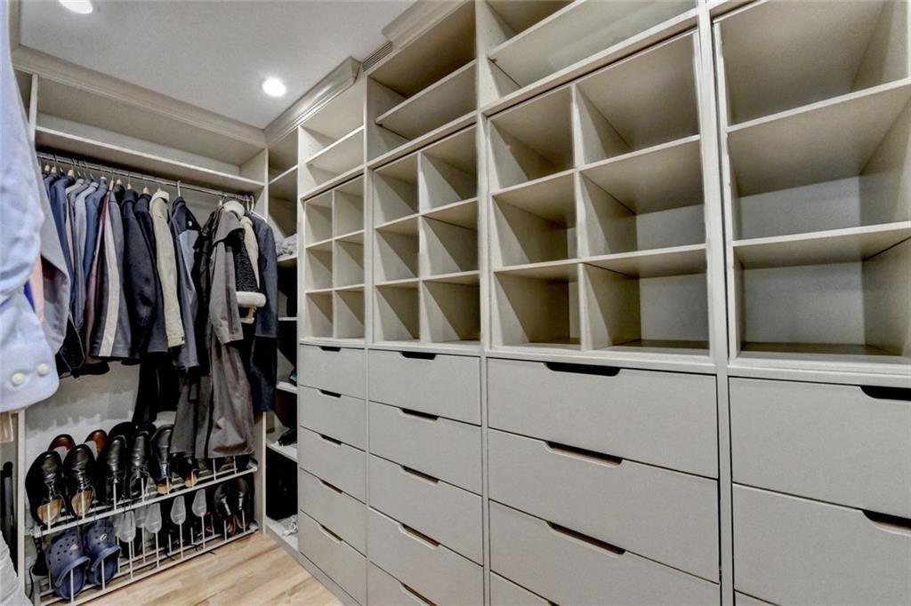 3310 Danielle Way Suwanee, GA 30024 - Photo 14 of 31 a view of walk in closet with clothes and shoes