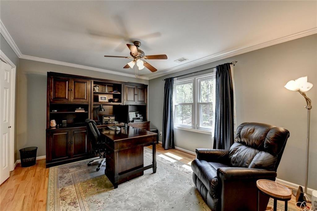 3310 Danielle Way Suwanee, GA 30024 - Photo 17 of 31 a livingroom with workspace couch and a window
