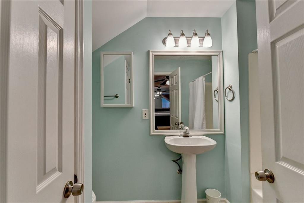 3310 Danielle Way Suwanee, GA 30024 - Photo 22 of 31 a bathroom with a sink and a mirror