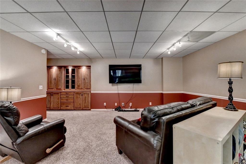 3310 Danielle Way Suwanee, GA 30024 - Photo 25 of 31 a living room with furniture and a flat screen tv