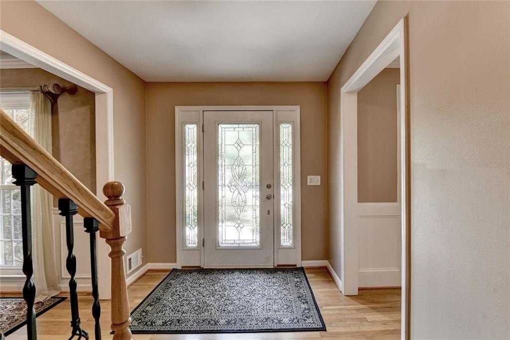 3310 Danielle Way Suwanee, GA 30024 - Photo 3 of 31 a view of entryway with wooden floor and stair