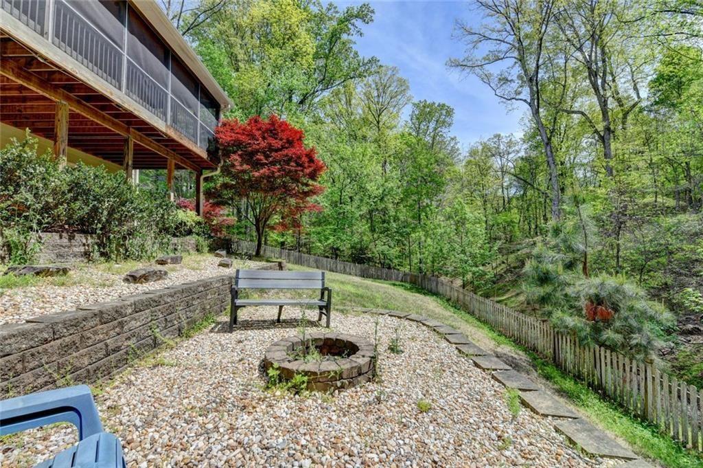 3310 Danielle Way Suwanee, GA 30024 - Photo 31 of 31 a backyard of a house with outdoor seating
