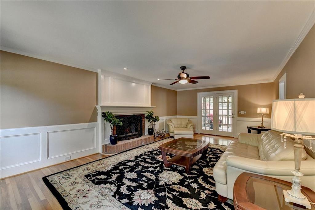 3310 Danielle Way Suwanee, GA 30024 - Photo 4 of 31 a living room with furniture and a fireplace