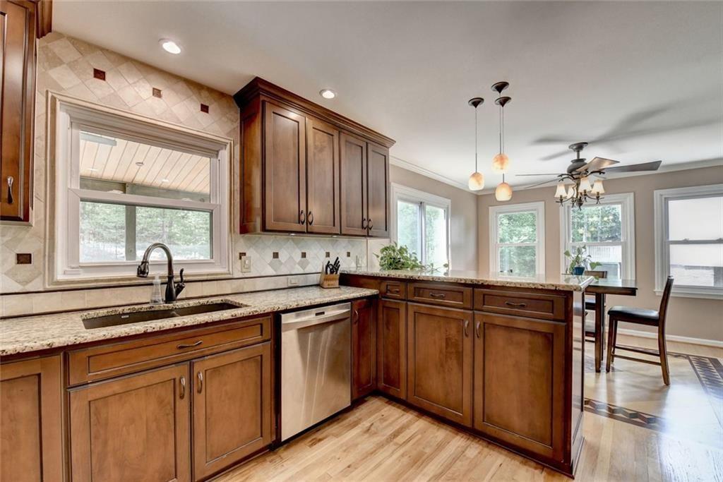 3310 Danielle Way Suwanee, GA 30024 - Photo 7 of 31 a kitchen with lots of counter top space and sink