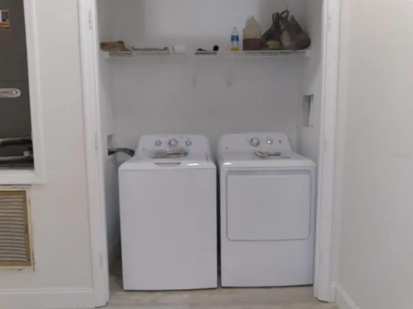 a utility room with dryer and washer