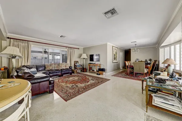 a living room with furniture and a table