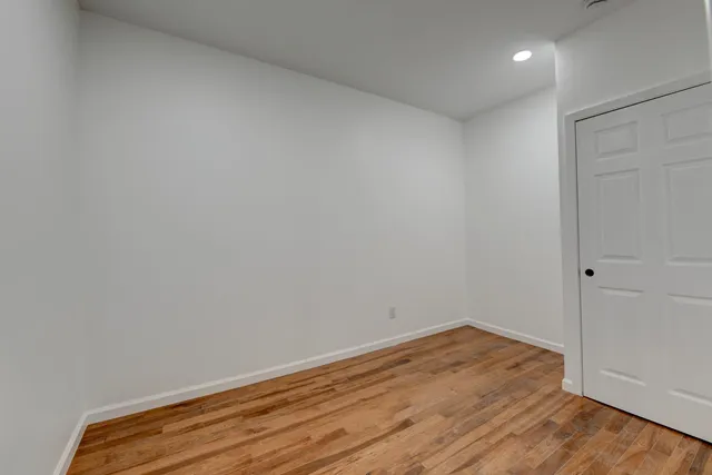 a view of room with wooden floor