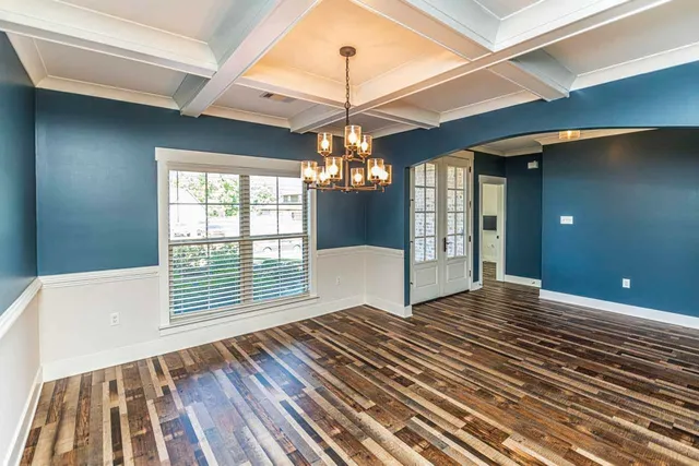 a view of a room with window and wooden floor