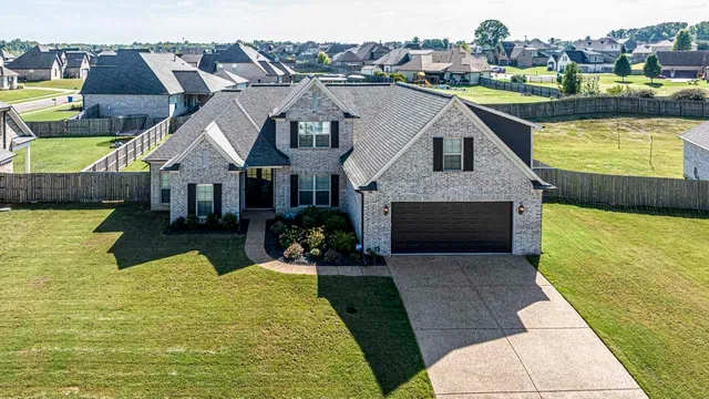 an aerial view of a house with swimming pool