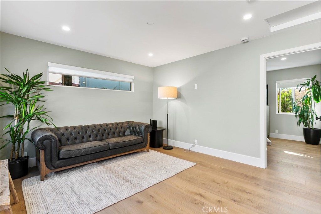 354 La Perle Place, Unit B Costa Mesa, CA 92627 - Photo 6 of 16 a living room with furniture and a potted plant