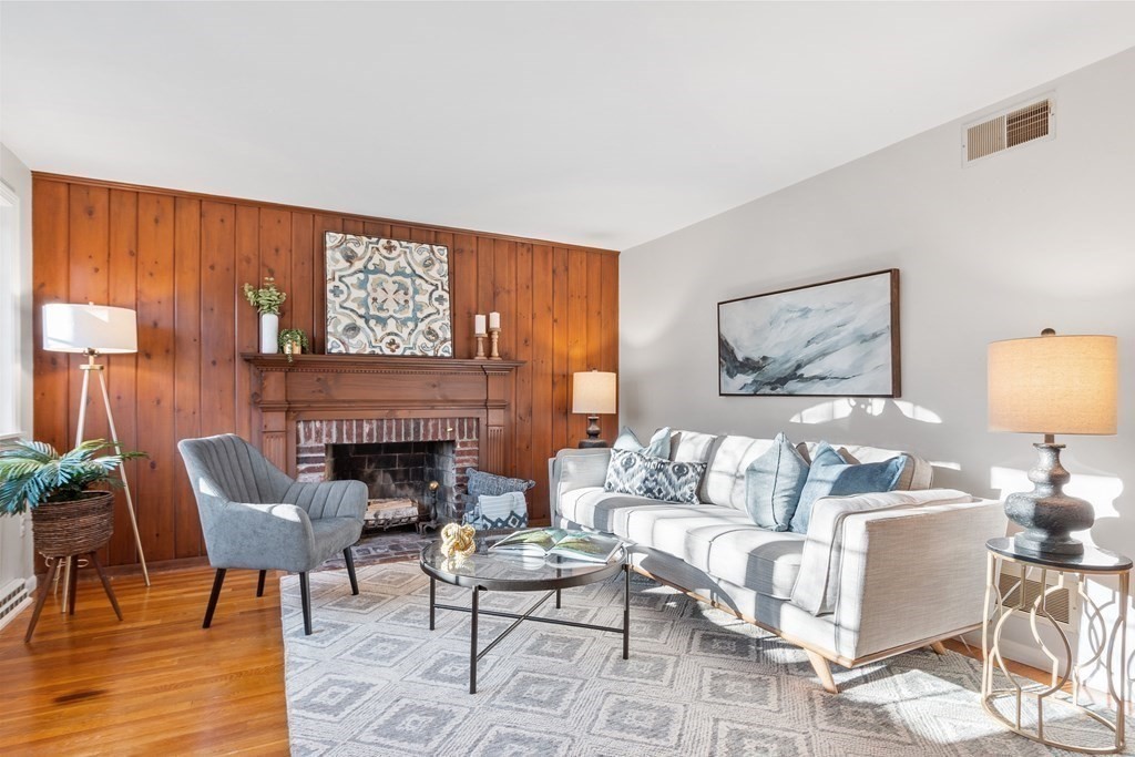 498 Stow Road Boxborough, MA 01719 - Photo 4 of 40 a living room with furniture and a fireplace