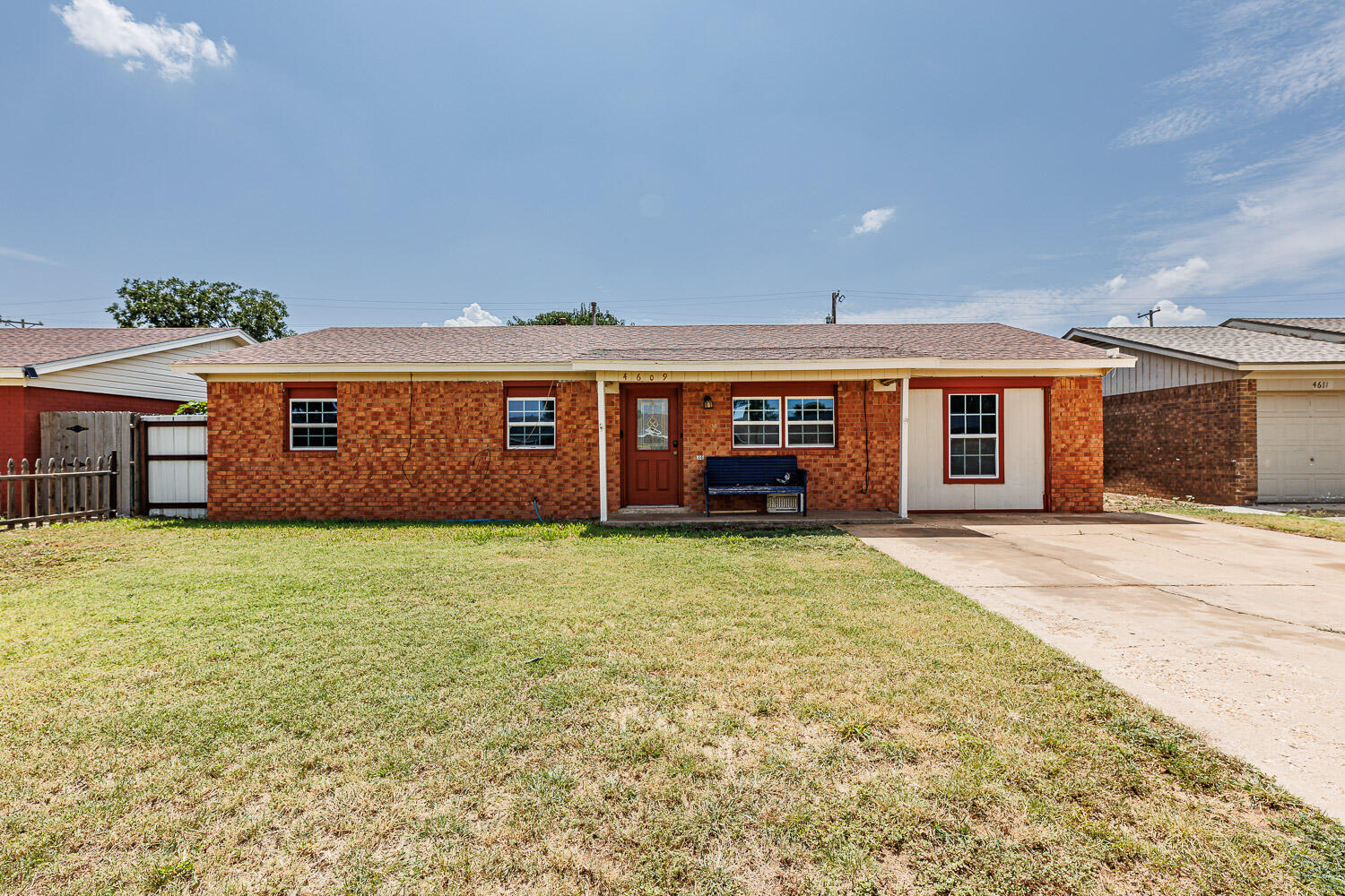 4609 Kemper Street Lubbock, TX 79416 - Photo 1 of 33 a front view of a house with a garden