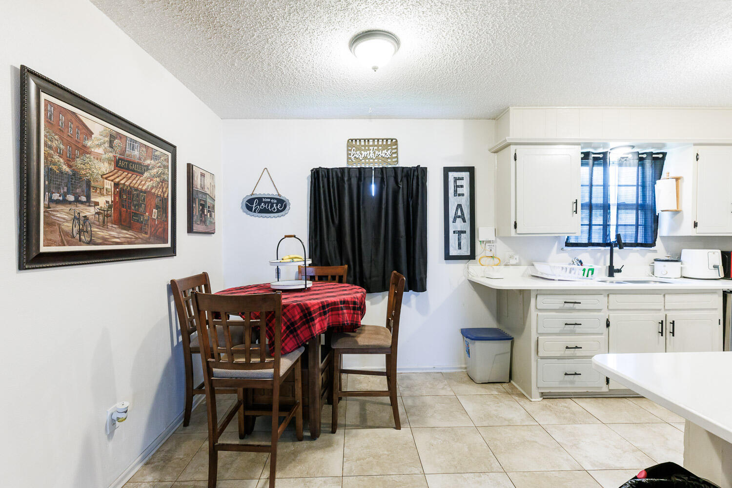 4609 Kemper Street Lubbock, TX 79416 - Photo 11 of 33 a view of a dining room with furniture