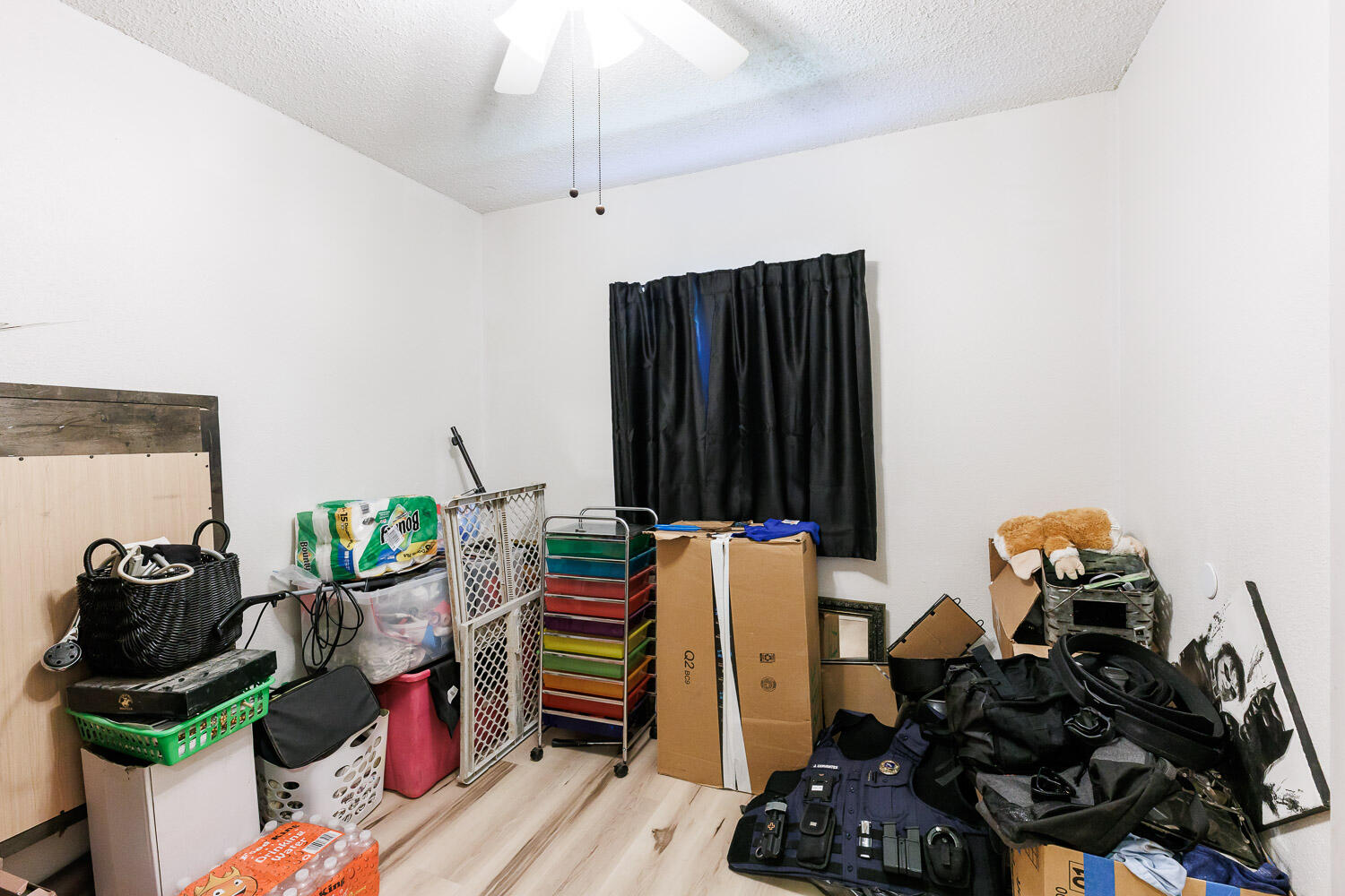4609 Kemper Street Lubbock, TX 79416 - Photo 20 of 33 a room with furniture and a potted plant