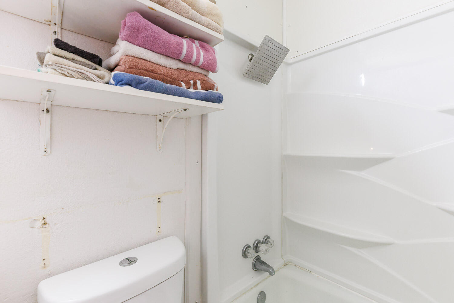 4609 Kemper Street Lubbock, TX 79416 - Photo 26 of 33 a bathroom with a toilet and shower