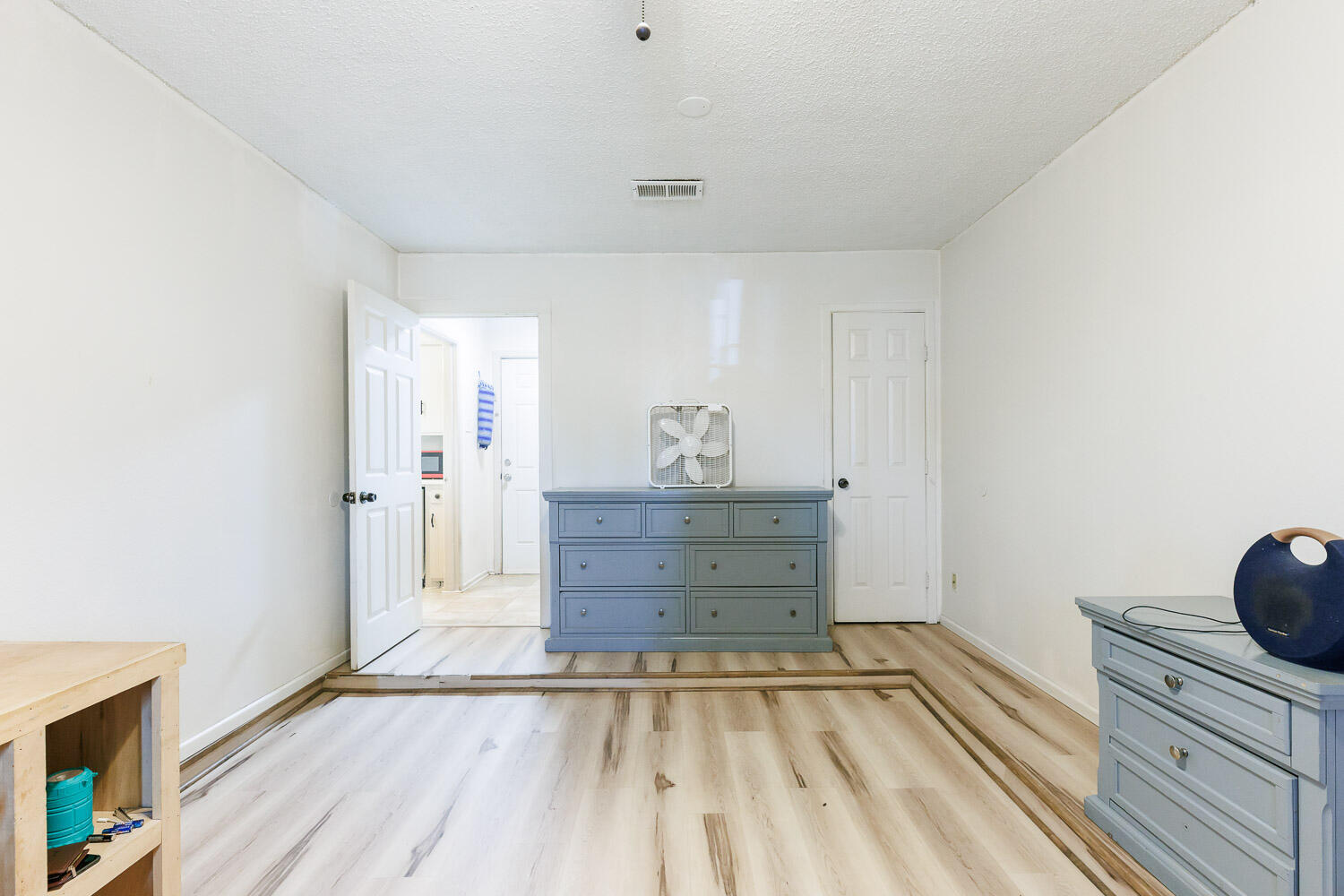 4609 Kemper Street Lubbock, TX 79416 - Photo 29 of 33 a view of a hallway with wooden floor and closet