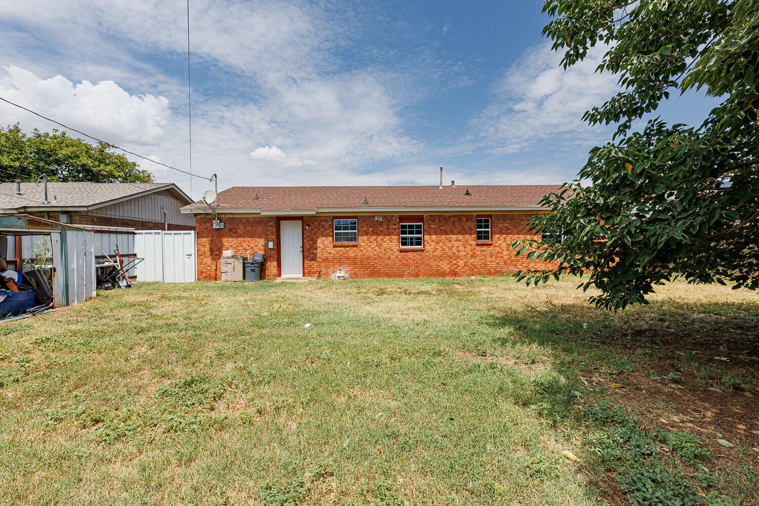 4609 Kemper Street Lubbock, TX 79416 - Photo 32 of 33 a front view of a house with a yard