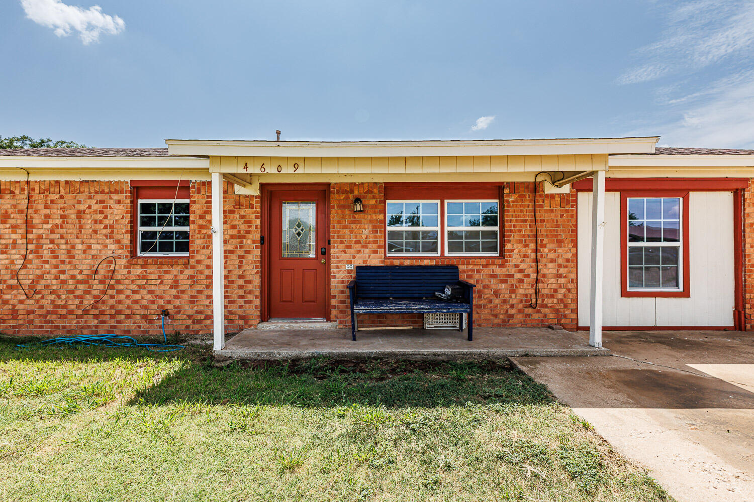 4609 Kemper Street Lubbock, TX 79416 - Photo 6 of 33 a front view of a house with garden