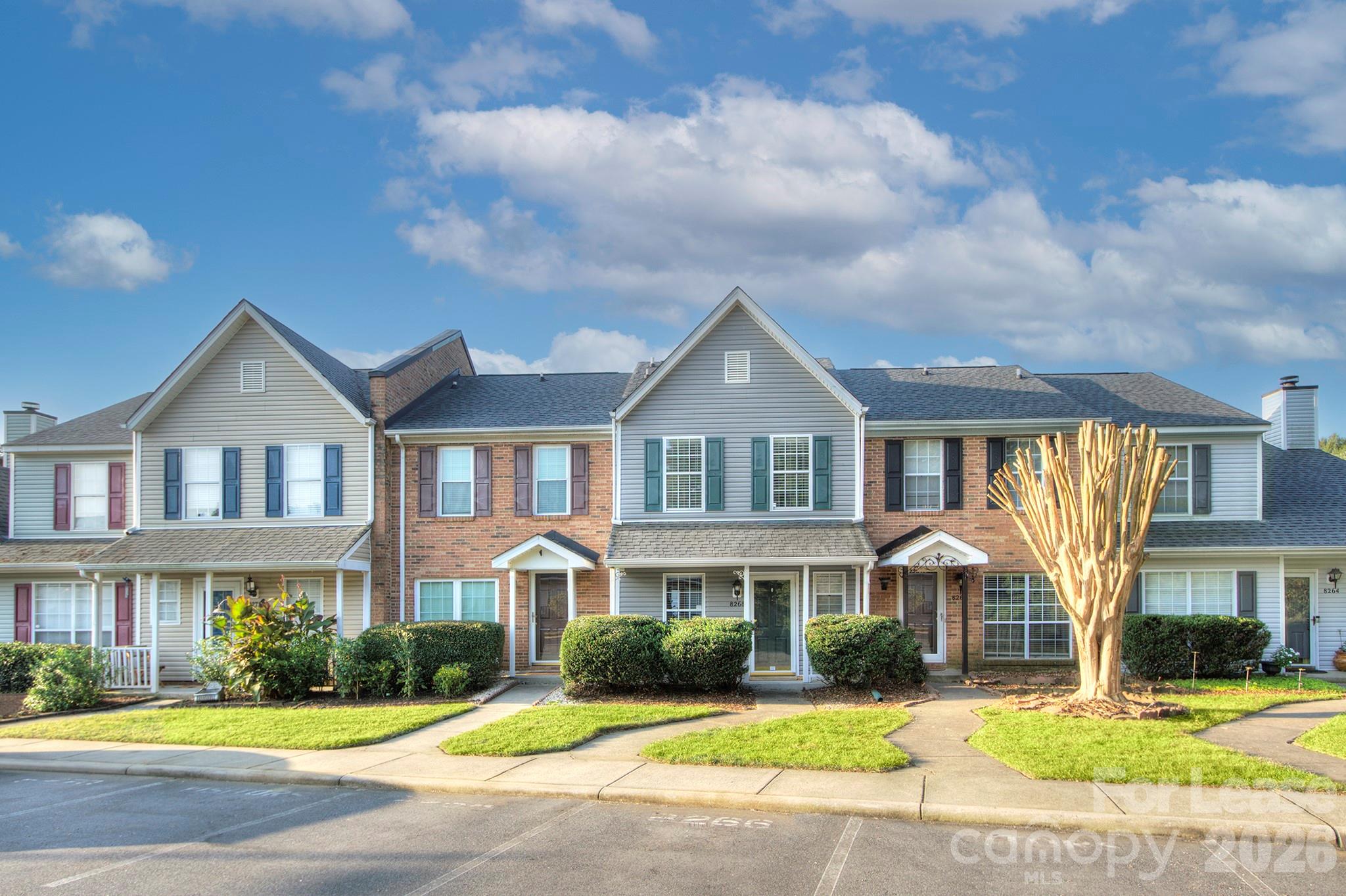 8268 Golf Ridge Drive Charlotte, NC 28277 - Photo 2 of 24 a front view of residential houses with yard and green space
