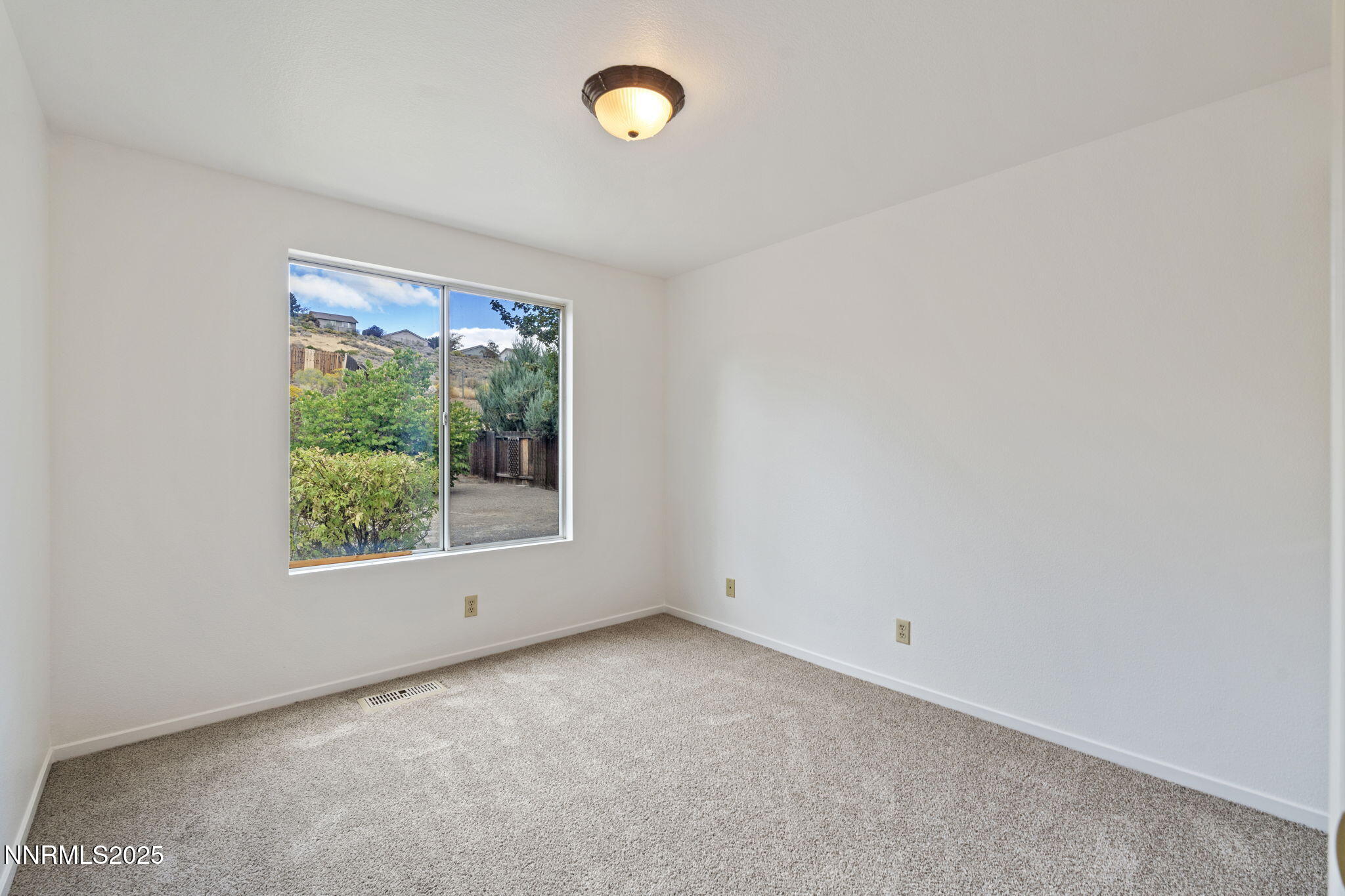 6811 Sonterra Lane Reno, NV 89523 - Photo 15 of 25 an empty room with a window
