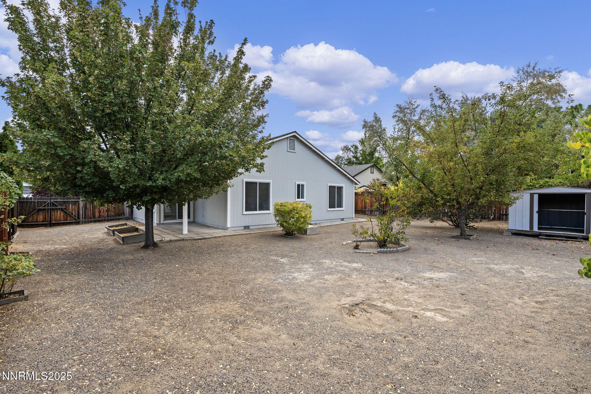 6811 Sonterra Lane Reno, NV 89523 - Photo 22 of 25 a view of a house with a yard and garage