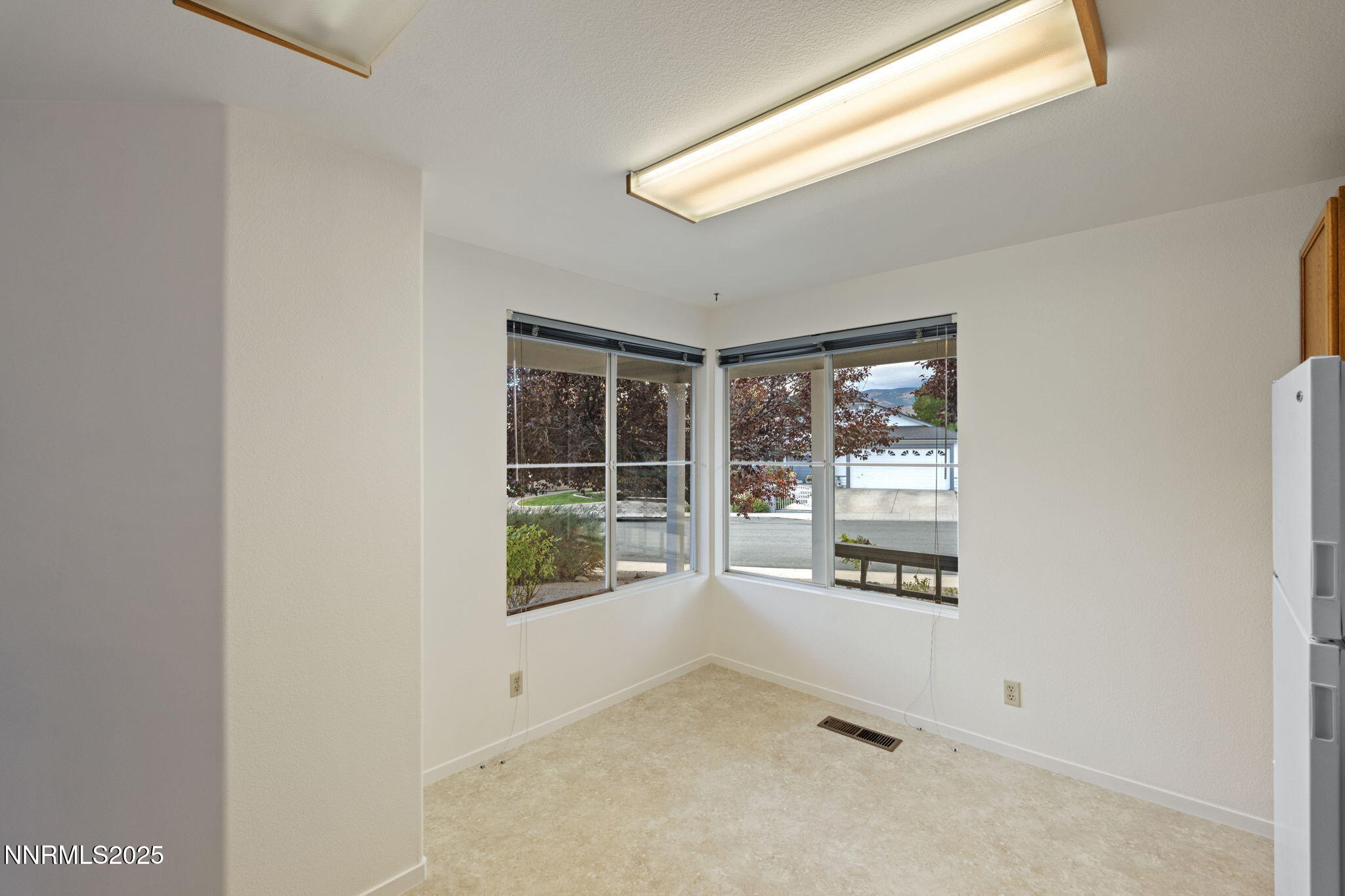 6811 Sonterra Lane Reno, NV 89523 - Photo 9 of 25 a view of an empty room with a window