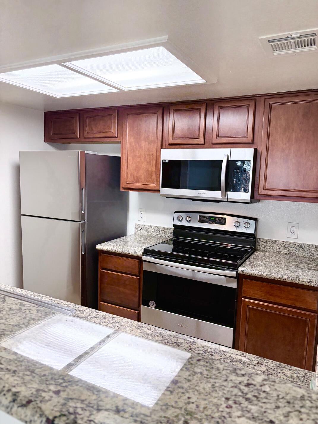 43376 Cook Street, Unit 32 Palm Desert, CA 92211 - Photo 9 of 31 a kitchen with a appliances and a sink