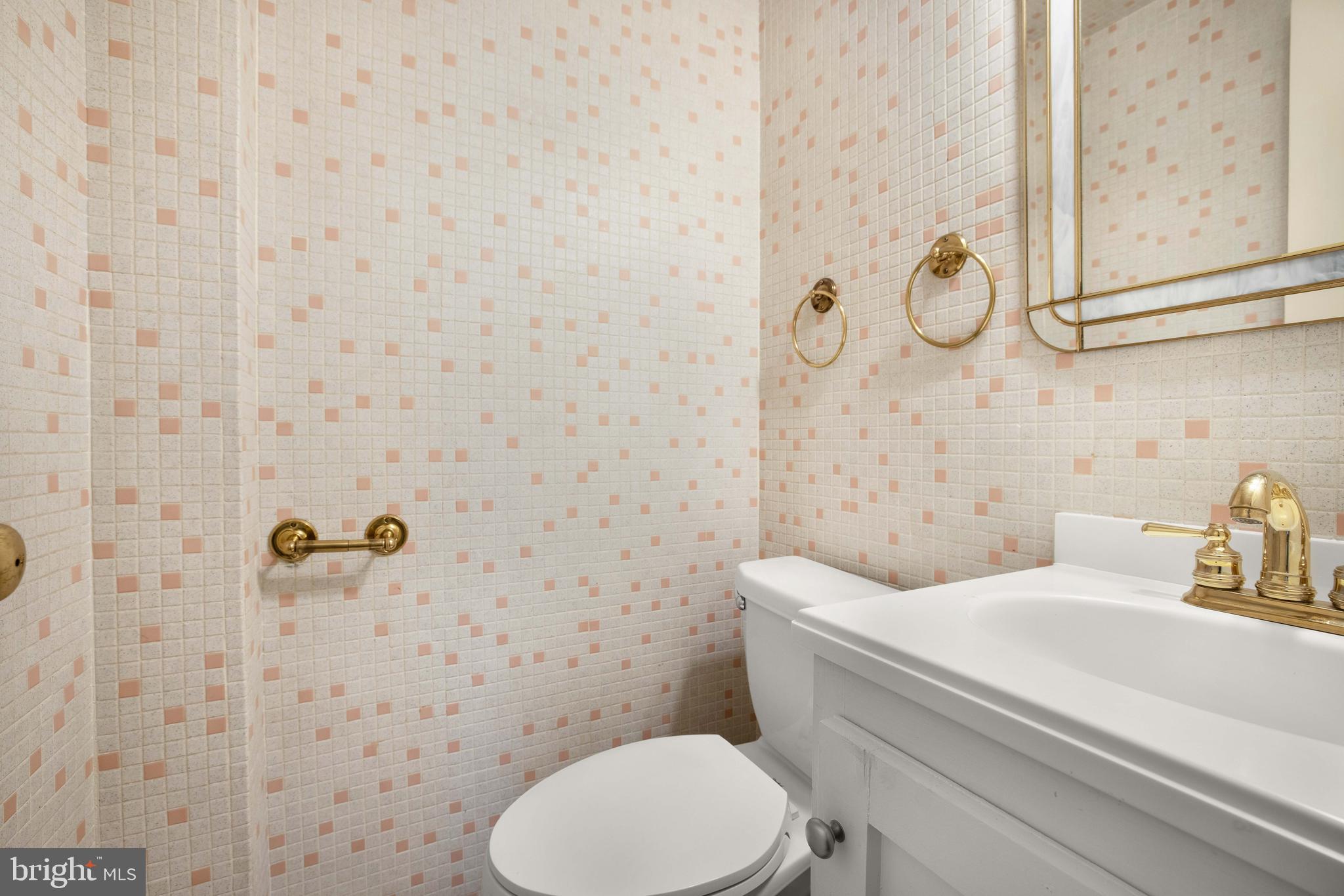 3327 R Street Northwest Washington, DC 20007 - Photo 16 of 39 a bathroom with a sink a toilet and a shower curtain