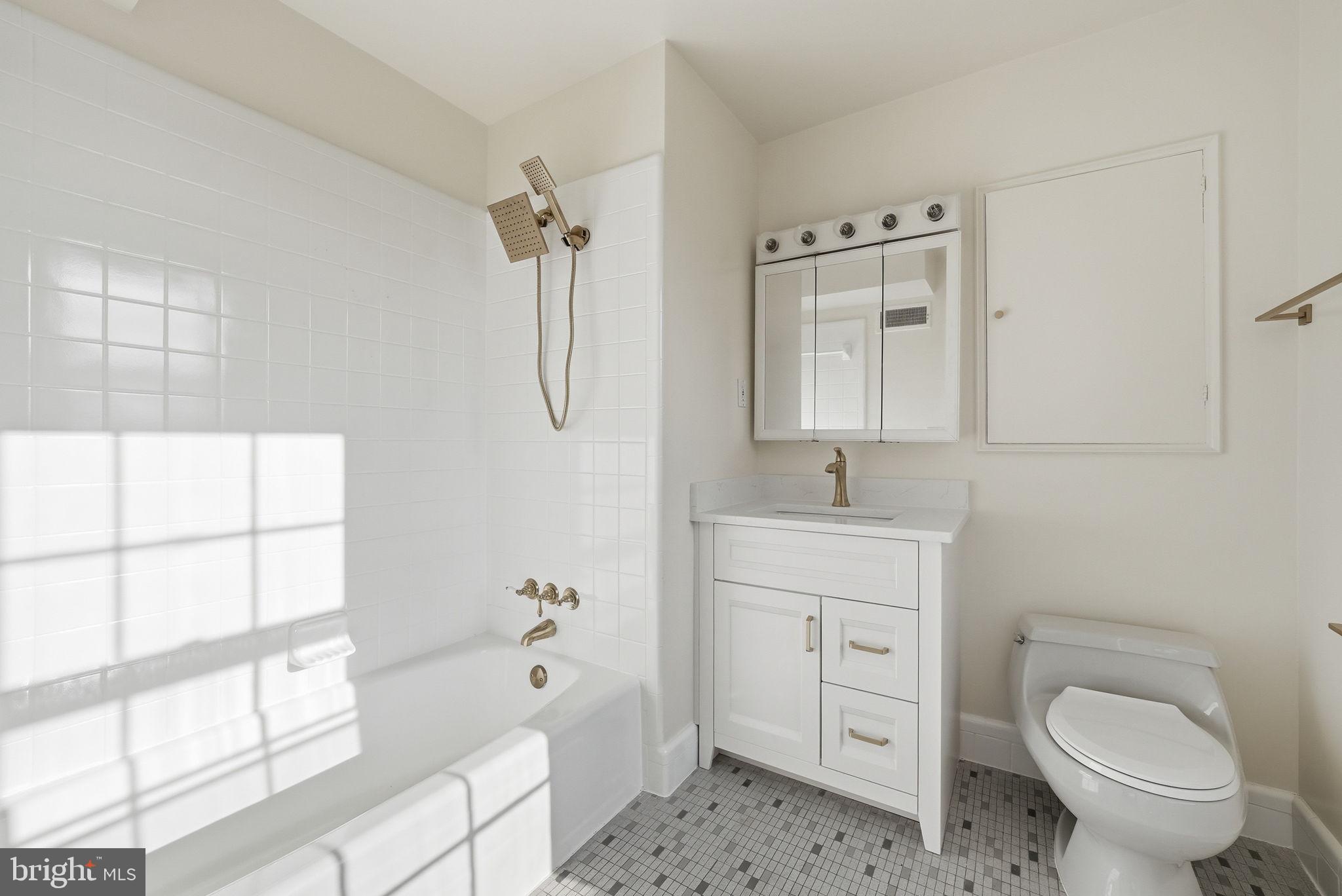 3327 R Street Northwest Washington, DC 20007 - Photo 20 of 39 a bathroom with a sink a toilet and shower