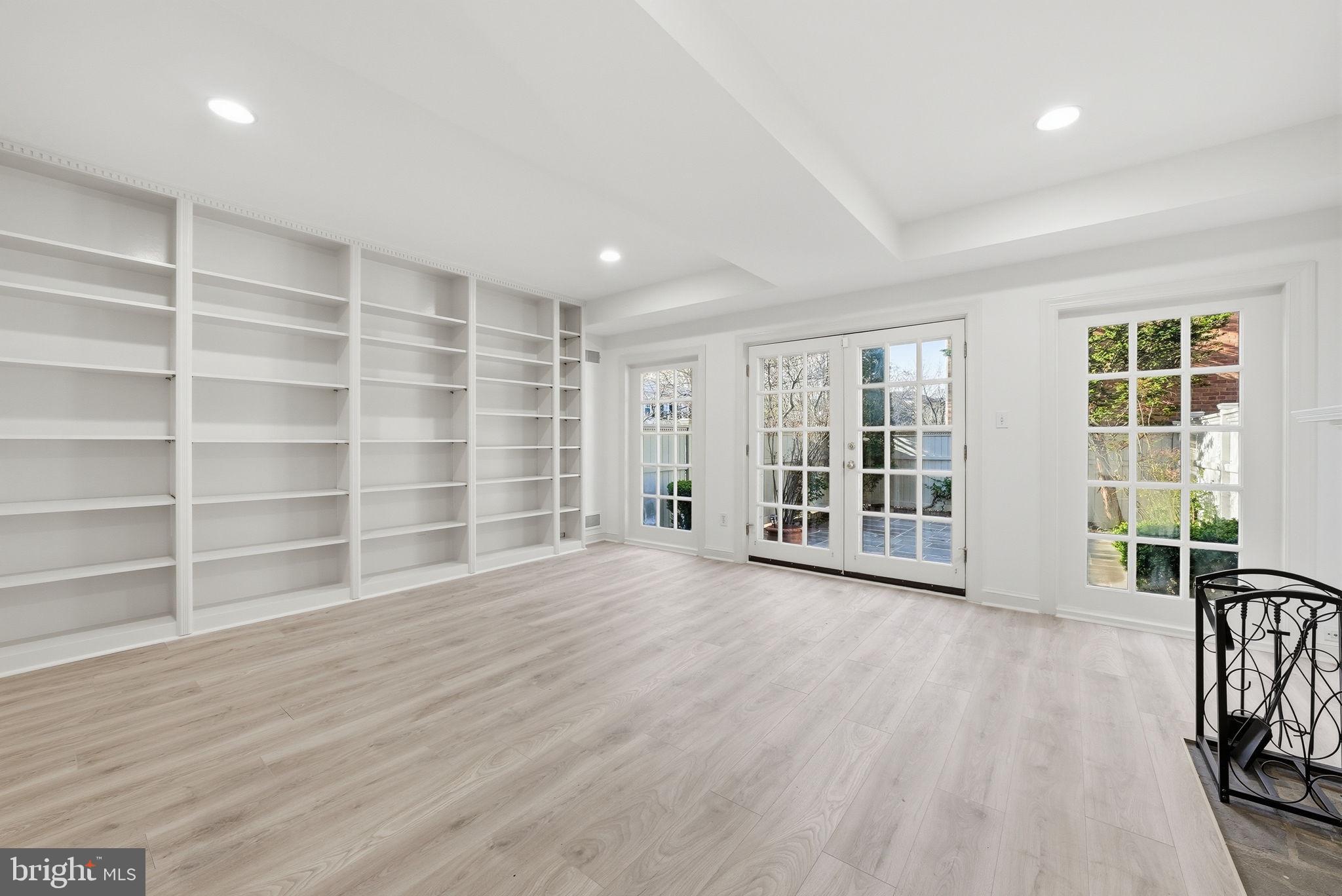 3327 R Street Northwest Washington, DC 20007 - Photo 33 of 39 a view of an empty room with a window and wooden floor