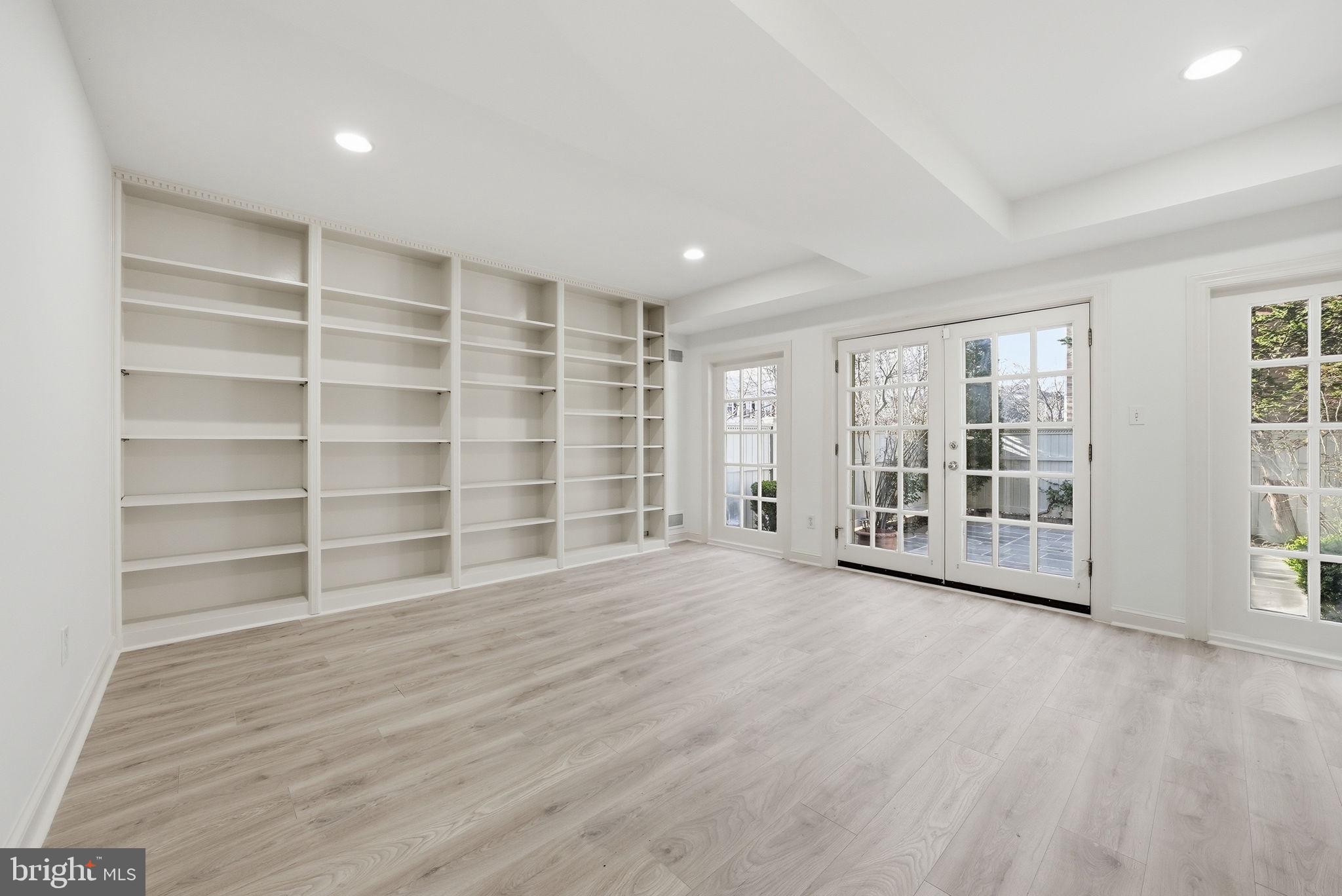 3327 R Street Northwest Washington, DC 20007 - Photo 34 of 39 a view of an empty room with a window and wooden floor